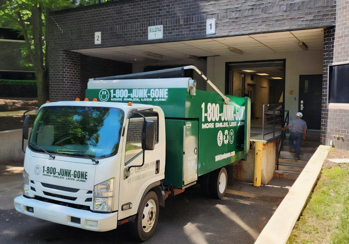 1800junkgone truck in front of a building